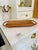 A vintage Rubel & Co. bentwood serving tray crafted from warm-toned pine with gracefully curved rattan-style handles....