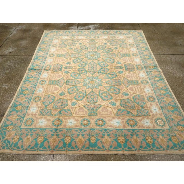 An antique Indian Cotton Agra carpet. The light yellow field of this northern Indian workshop rug displays two...