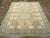 An antique Indian Cotton Agra carpet. The light yellow field of this northern Indian workshop rug displays two...