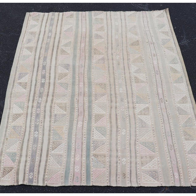 Measures: 3'9 x 4'8 Vintage Turkish Kilim Rug with Soft Geometric Stripes in Sage, Blush, and Taupe. Keivan Woven Arts /...
