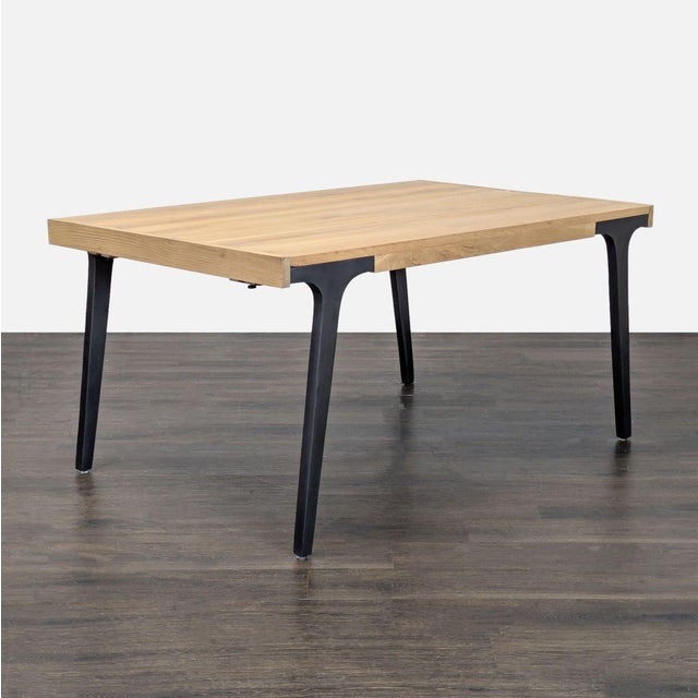 With 2 leaves, the table extends to 99 inches and seats 8. The table is white oak and rests on cast iron legs. Brand:...
