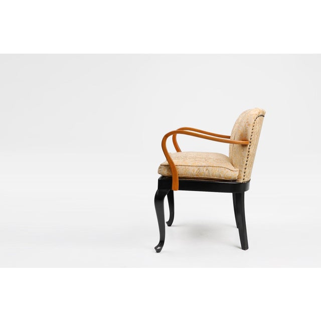 This 1940s French Art Deco side chair captures the refined geometry and understated luxury that defined the final phase of...