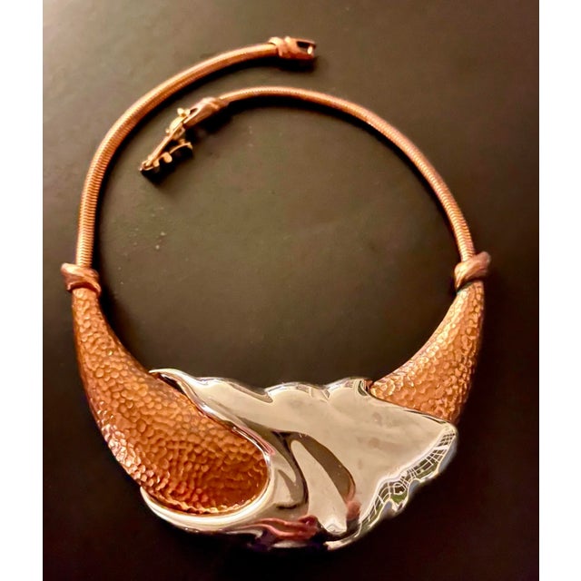 This is part of Chairish’s Costume Jewelry assortment. Rare and unique copper and silver tone metal necklace by Monet,...