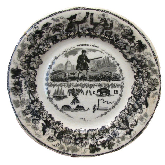 Rare pair of 19th C. French Rebus plates from the esteemed porcelain house of Creil & Montereau. Discovered in Bayeux...