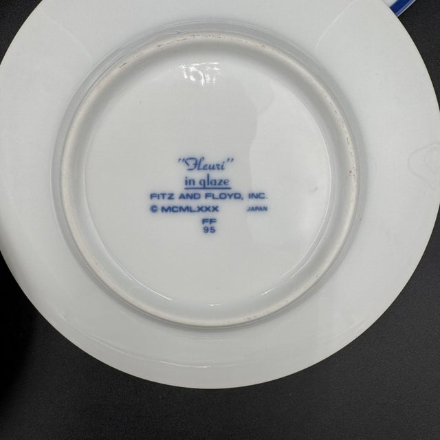 Produced from 1984-1987. Set of 4 Saucers Blue rings with orange and yellow flowers. Additional Pieces available in...