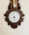 Quality antique Victorian carved walnut banjo clock barometer having a quality carved walnut barometer with a quality...