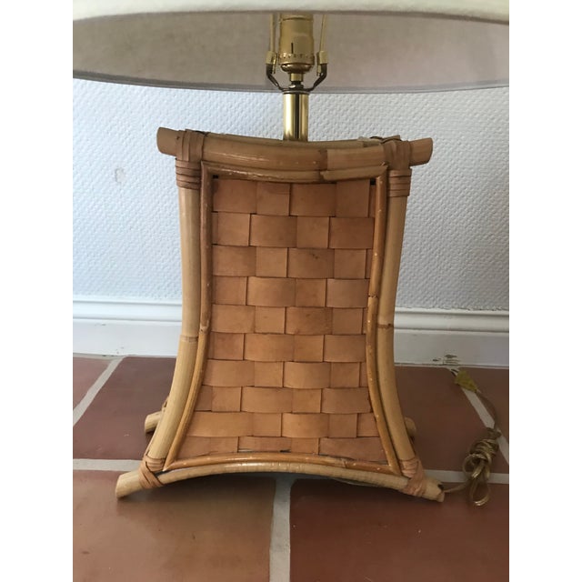 This is a great pair of unique bamboo and leather strap lamps probably from the 1970s