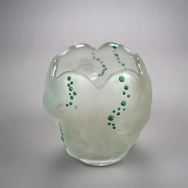 A figural vase in the manner of Lalique offers in relief underwater scene with fish and applied enamel bubbles, unsigned,...