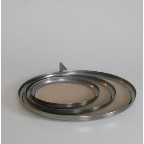 Serving Trays in stainless steel with a hand-brushed finish and majestic leather inlay. Dimensions: Small: Diameter 9” w x...
