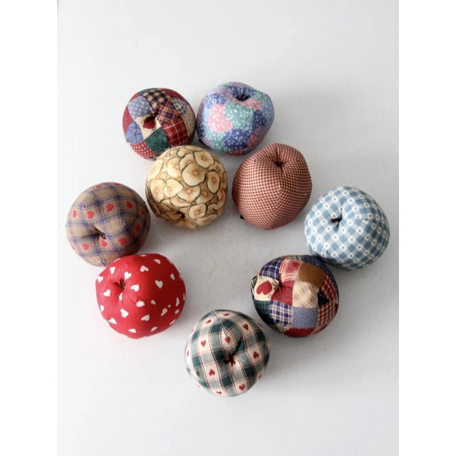 Add a touch of rustic charm to your autumn decor with this collection of nine vintage hand-crafted apple ornaments. These...