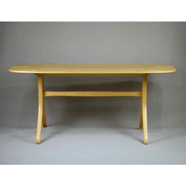 The legs made in solid birch and the top veered with masur birch (Karelian birch) This piece has an attribution mark, I am...