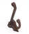 Antique Eastlake style hook made of cast iron with a black finish. The original mounting screws are not available. Good...