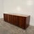 Mid century modern kip Stewart for Drexel tambour door low credenza. This unique credenza sits upon wheels and has a large...