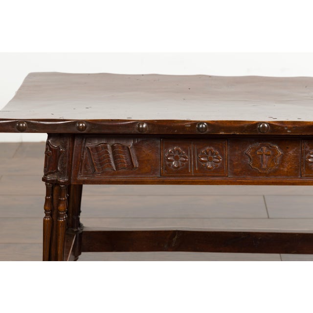 An English Georgian period walnut bench from the early 19th century, with lift top and cross motifs. Created in England...