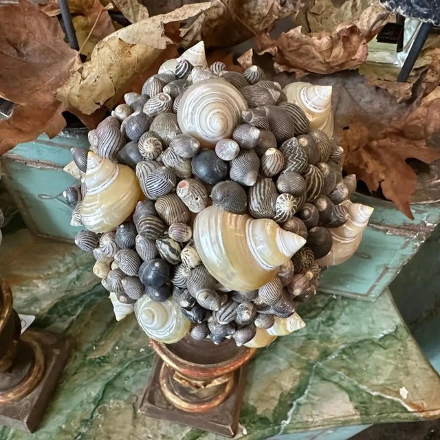 Two lacquered wood palm holders with a shell composition, handcrafted in Sicily in the late 19th century, are in original...