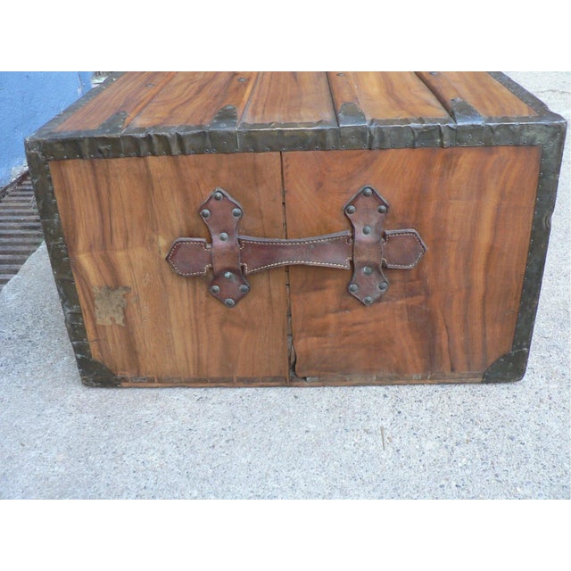 - Antique wooden travel trunk from before 1890s - Made of solid wood, with brass and leather handles - Dimensions: 36 x...
