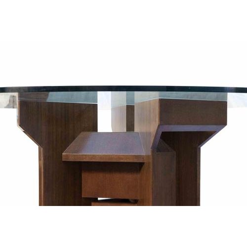 A refined example of 1960s modernist design, this sculptural table is distinguished by its bold architectural base and...