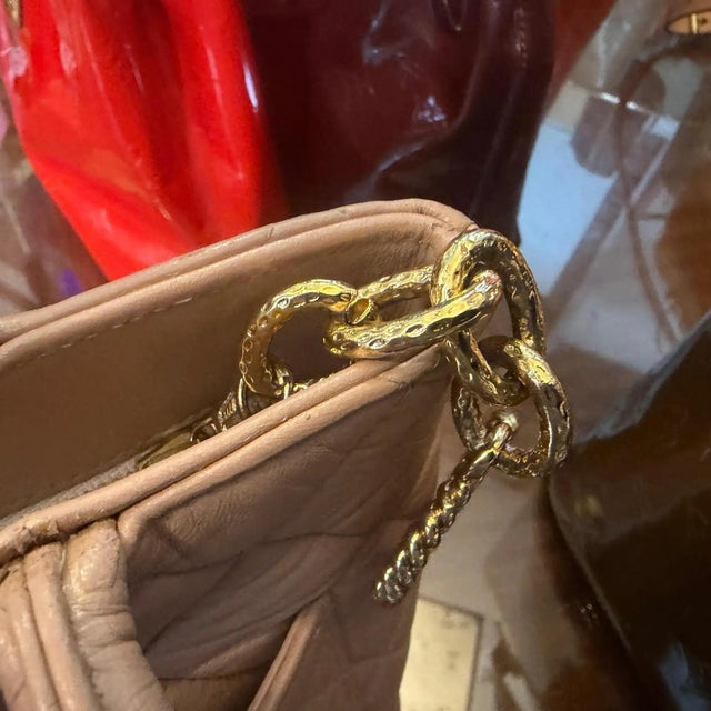 This vintage Chanel Matelassé Tote Bag is crafted in soft light pink lambskin leather with iconic diamond quilting and an...