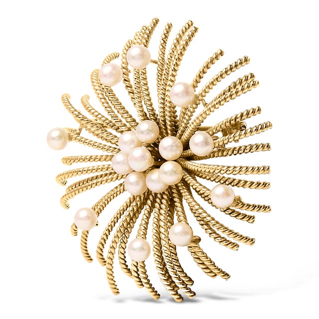 The splendor of celestial wonders is perfectly encapsulated in this exquisite brooch, a masterpiece crafted from luminous...