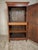 Handcrafted from solid French oak, this antique bonnetière embodies the quiet elegance and practical craftsmanship of...