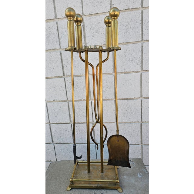 A 19th Century Ball Head Brass Fireplace Tools Set in good antique condition. Measures 11" in width, 7.5" in depth and...