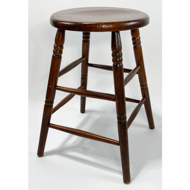 Vintage turned wood farmhouse style stool with rich finish. Seat measures 15"dia, making an ideal candidate as a seat or...