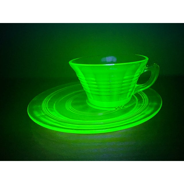 This authentic vintage Anchor Hocking uranium glass cup and saucer set features the desirable “Circle Green” pattern,...