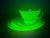 This authentic vintage Anchor Hocking uranium glass cup and saucer set features the desirable “Circle Green” pattern,...