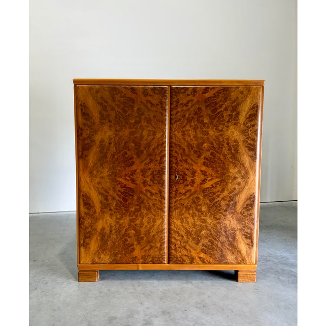 Handsome 1930’s European Art Deco Burlwood Gentleman’s Chest Dresser or Storage Cabinet. A stunning piece with bookmatched...