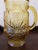 Late 60s, early 1970s beautiful Amber pitcher from Anchor Hocking. Pressed glass embossed with classic Rainflower pattern....
