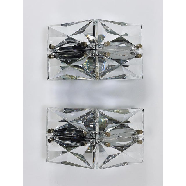A pair of exquisite triangular mid-century wall sconces from the 1970s, crafted to a high standard by kinkeldey in...