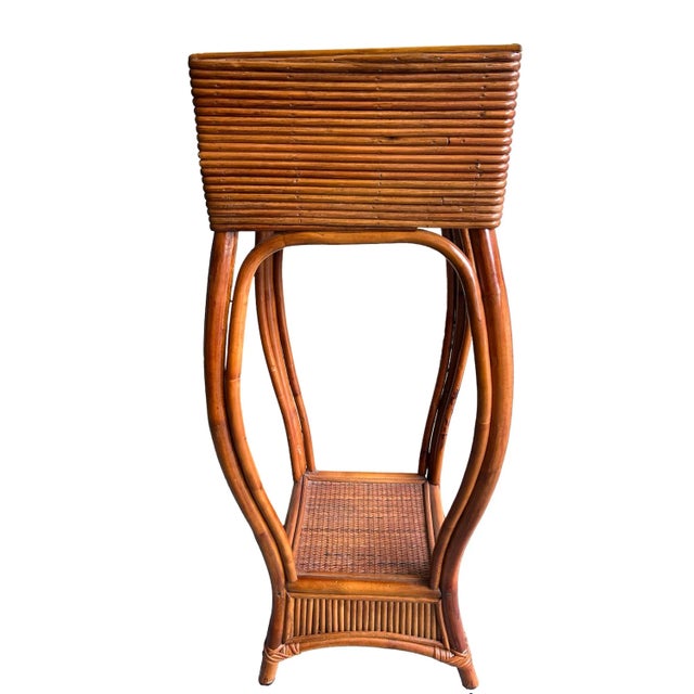Great looking vintage coastal plant stand. Nice and tall for an entryway. Beautiful pencil Reed bamboo planter box...