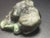 The sculpture of two bull frogs sitting beside an emerald Lilly pad. The item weighs 58 grams and is 2.2” length x 1.8”...