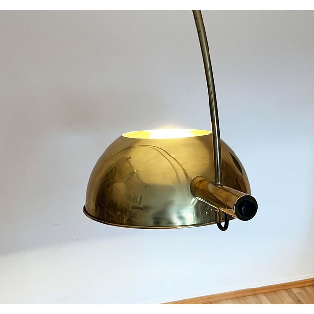 Rare curved floor lamp with clamp rod based on a design by renowned lighting designer Florian Schulz. The classification...