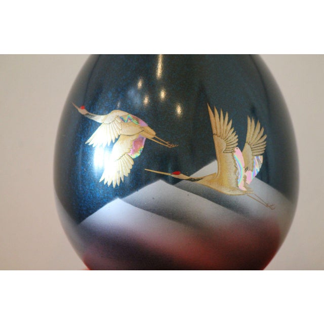 This beautiful vase is cast bronze and has an incredible gold and silver inlay. It stands 10" tall and has a simple,...