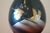 This beautiful vase is cast bronze and has an incredible gold and silver inlay. It stands 10" tall and has a simple,...