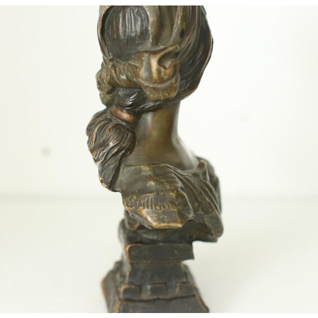 A finely modelled french art nouveau bronze bust of "cendrillon" by emmanuel villanis, france, circa 1900. This compact...