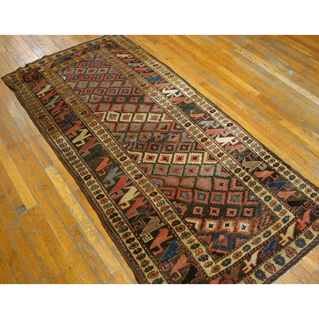 Early 20th Century W. Persian Kurdish Rug ( 3'4" x 6'9" - 102 x 206 ).. Antique Kurdish Persian Geometric Knotted Rug,...