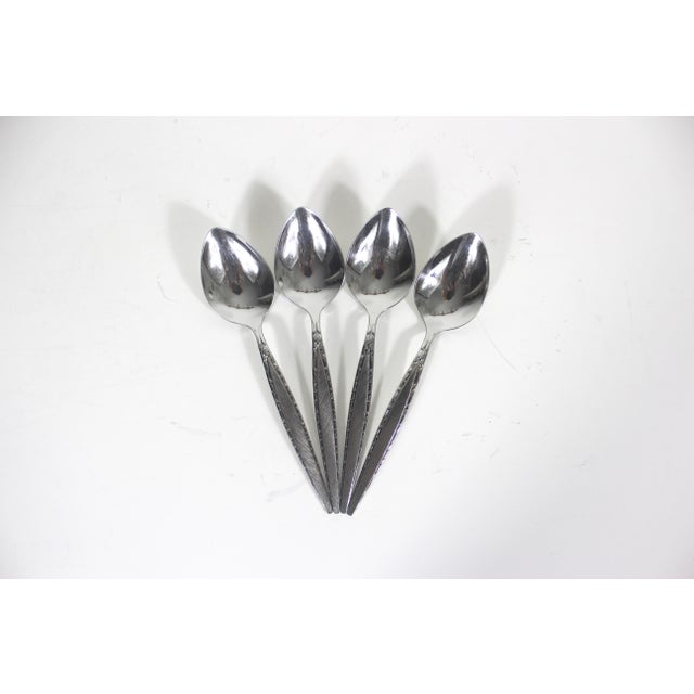 Matching set of 4 oval soup spoons stainless steel flatware from the sixties. This is the Venetia pattern by Oneida...