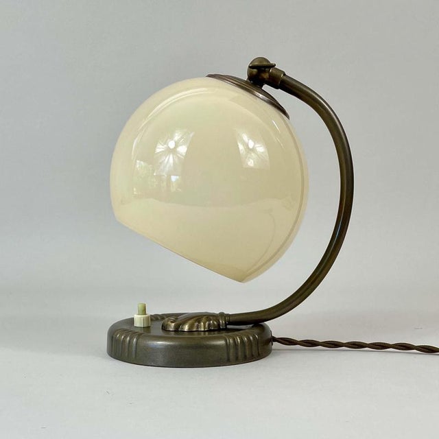 This art deco table light was designed and manufactured in germany in the 1930s to 1940s. The light features a rounded...
