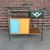 This is an amazing Arthur Umanoff outdoor bar cart. It has an iron frame, a rushed storage compartment, slatted wood...