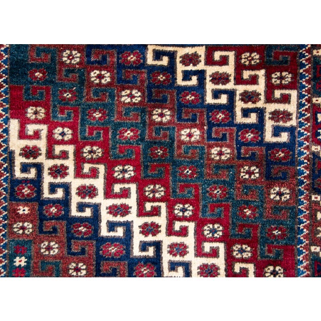 A beautiful vintage Turkish Konya rug with an all-over diagonal pattern with interlocking geometric stripes and petite...