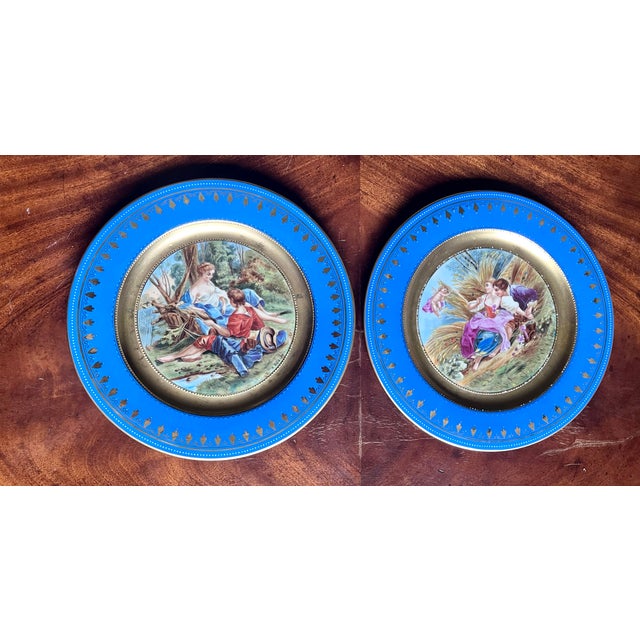 An exceptional, investment-grade pair of late 19th-century Austrian Royal Vienna style porcelain cabinet plates. Measuring...