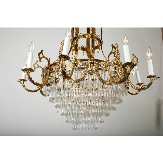 Early 1920's French Empire-style gold metal chandelier with original cut crystals. Wired for US use and in working...