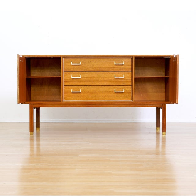 This vintage credenza is a beautiful example of E Gomme's Librenza range by E Gomme (G Plan). Produced in the early 1960s...