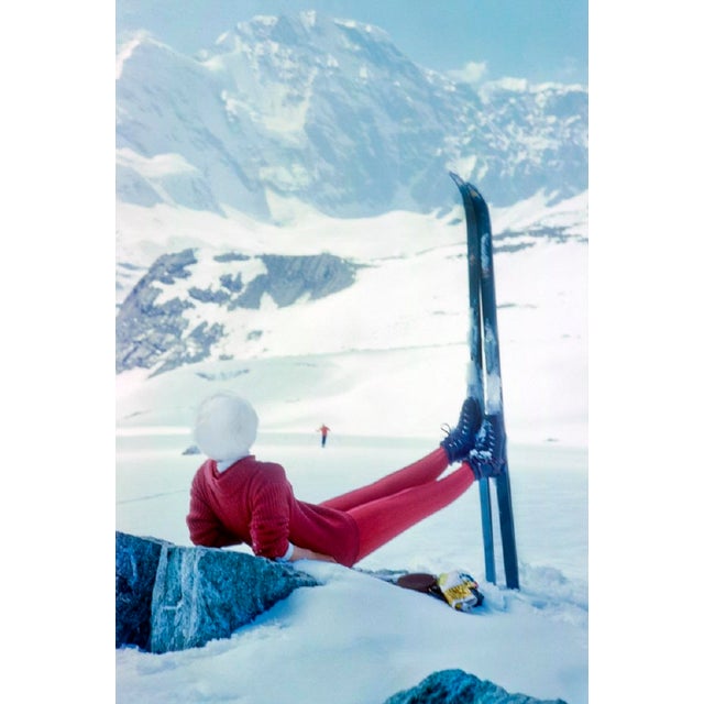 Haute Route Repose by Toni Frissell A skier admires the view from the top of a piste on the infamous “Haute Route",...