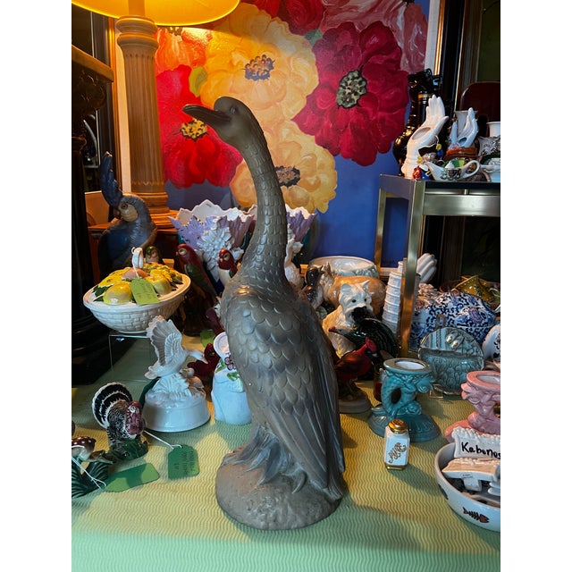 Up for consideration is a beautiful vintage standing brown goose sculpture. This would look lovely in your home, and it is...
