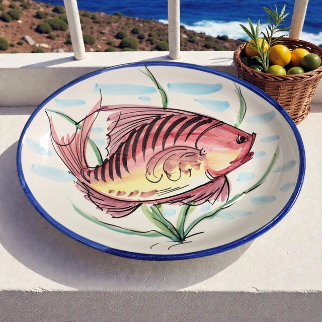The Italian Hand Painted Pottery Aurora Fish Oval Platter Wall Hanging is a stunning piece of art pottery crafted by hand...