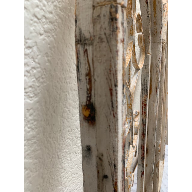 Vintage set of two cathedral church window wall decor. Metal and rustic distressed wood arched and aged for simulated...