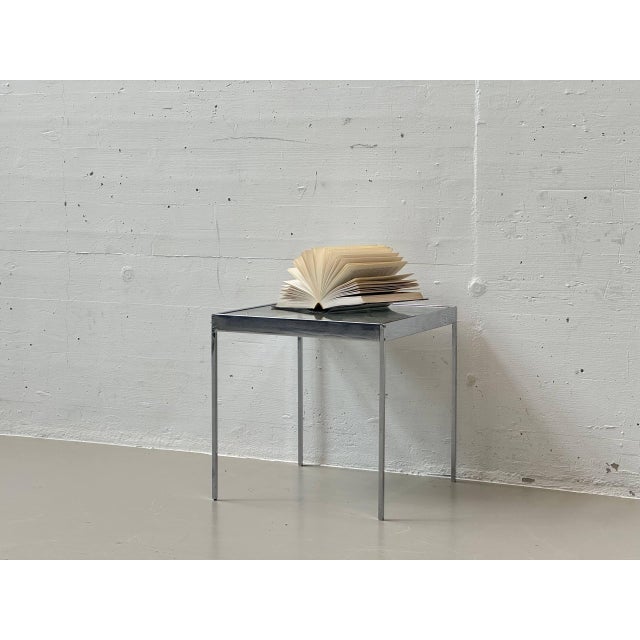 A delicate side table from around 1960, designed by dieter waeckerlin. A trained cabinetmaker, waeckerlin initially...